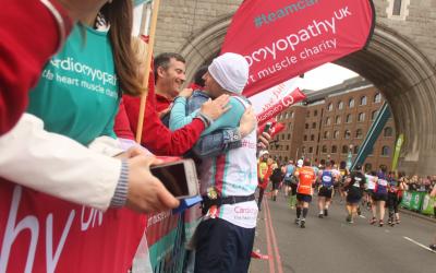 London marathon runner and spectator hug